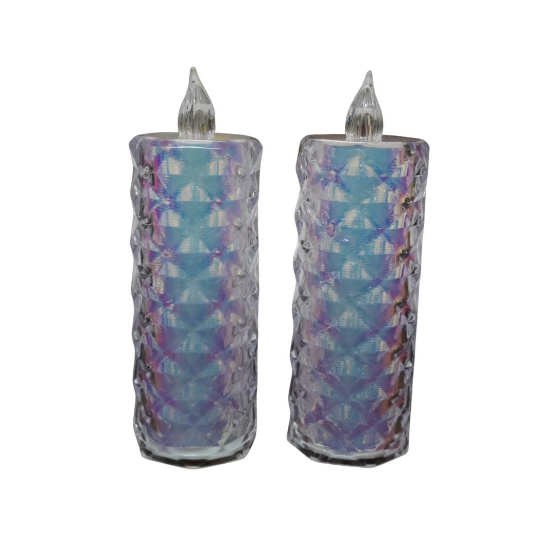 Two decorative candles with a patterned design on a white background
