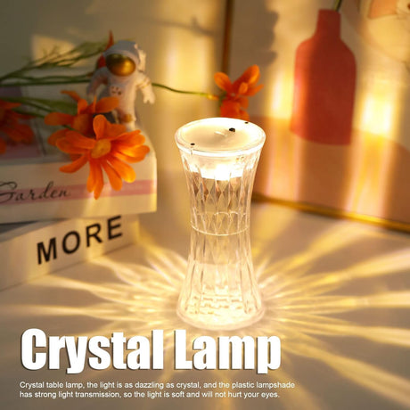 Crystal lamp on a surface with decorative items in the background